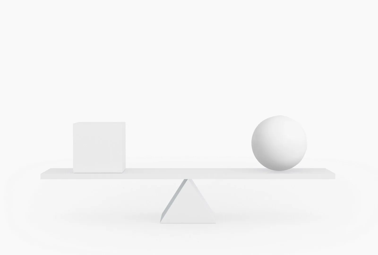 Un cube et une sphère en équilibre sur une planche
